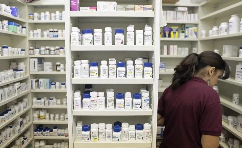 a pharmacy employee looks for medication as she works to fill a prescription while working at a pharmacy in new york photo reuters a pharmacy employee looks for medication as she works to fill a prescription while working at a pharmacy in new york photo reuters