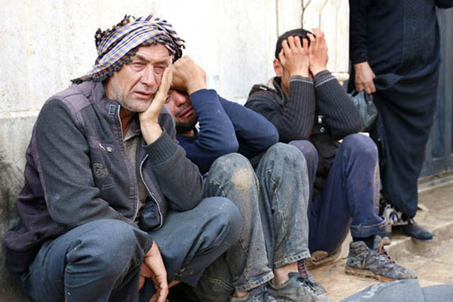 grief stricken syrian men cry at the site of a reported car bomb explosion in the rebel held town of azaz in northern syria on may 3 2017 five people killed were reportedly killed four civilians and one police officer photo afp