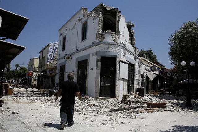 a man stands in front of a damaged building following an earthquake off the island of kos greece photo reuters