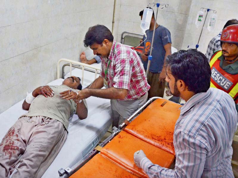 a doctor treats an injured victim of the monday night blast photo app