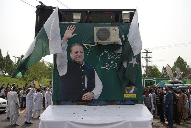 supporters of deposed prime minister nawaz sharif gather around a container prepared for a rally led by sharif in islamabad on august 9 2017 photo afp