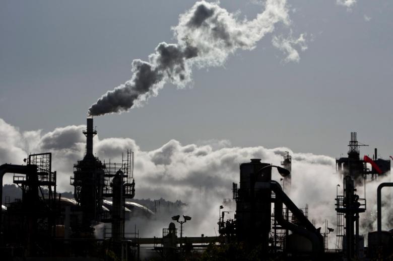 smoke is released into the sky at a refinery photo reuters