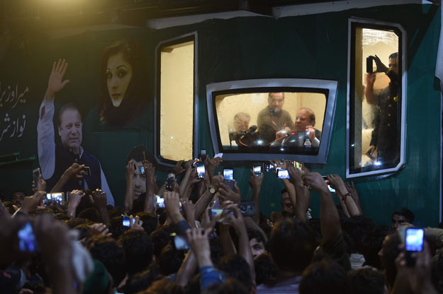 ousted pakistani prime minister nawaz sharif addresses a rally from his bullet proof container in rawalpindi on august 9 2017 deposed pakistani prime minister nawaz sharif is leading a rally from the capital islamabad to his home in lahore following his ouster by the supreme court following a corruption probe photo afp