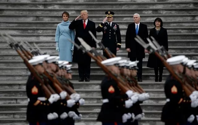 newly inaugurated u s president donald trump in red tie first lady melania l vice president mike pence and his wife karen r preside over a military parade during trump 039 s swearing ceremony in washington u s january 20 2017 photo reuters newly inaugurated u s president donald trump in red tie first lady melania l vice president mike pence and his wife karen r preside over a military parade during trump 039 s swearing ceremony in washington u s january 20 2017 photo reuters