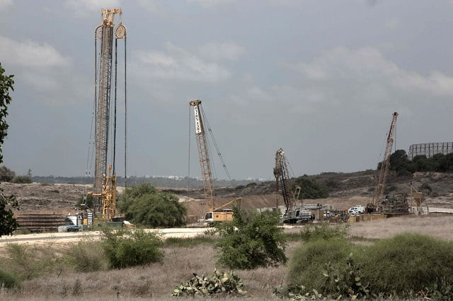 this file photo taken on september 08 2016 shows cranes and other machines working at the israeli side of the border fence with the gaza strip israel is pushing forward on a project to build a giant underground wall surrounding the gaza strip to stop tunnels that could be used in cross border attacks the army and israeli media said on august 10 2017 photo afp this file photo taken on september 08 2016 shows cranes and other machines working at the israeli side of the border fence with the gaza strip israel is pushing forward on a project to build a giant underground wall surrounding the gaza strip to stop tunnels that could be used in cross border attacks the army and israeli media said on august 10 2017 photo afp
