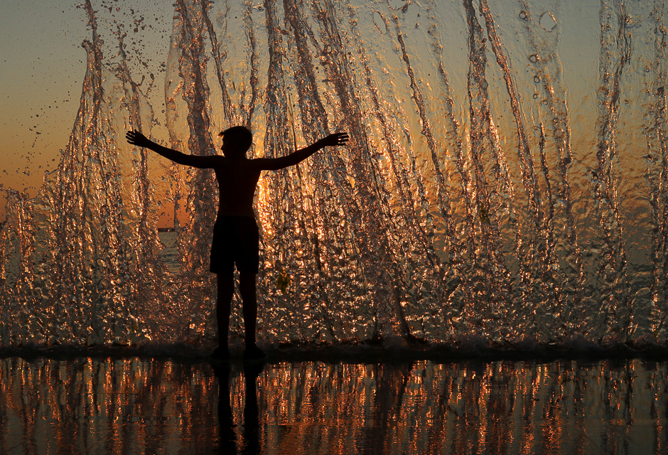 a boy enjoy the waves during sunset on an embankment in the black sea port of sevastopol crimea photo reuters