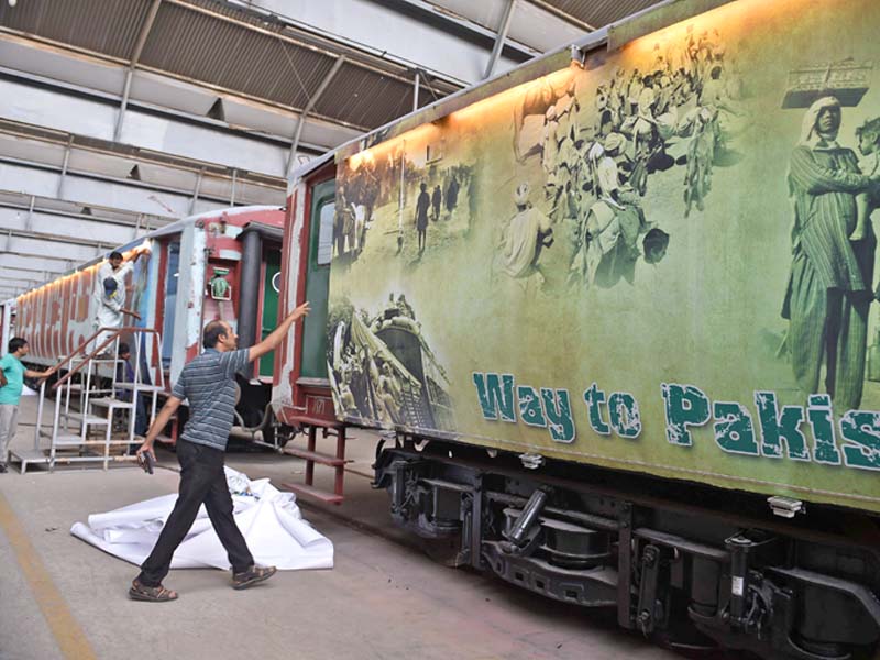 pakistan railways employees walk past azadi train photo afp