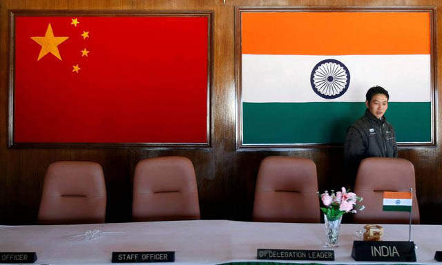 a man walks inside a conference room used for meetings between military commanders of china and india at the indian side of the indo china border at bumla in arunachal pradesh photo reuters