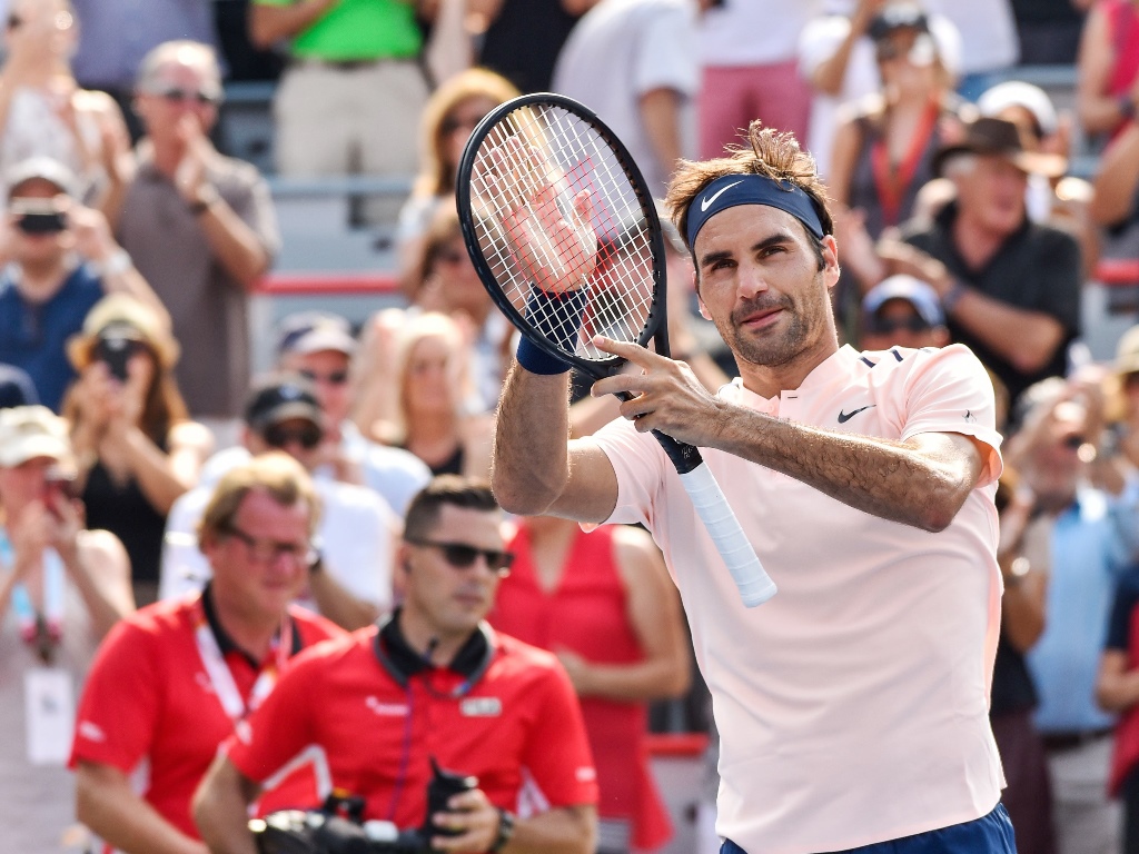 unfaltering federer hammered five aces made just two double faults and won 81 of his first serve points in the 68 minute centre court match photo afp