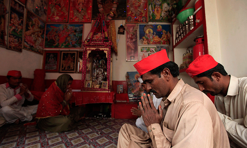 members of hindu community pray inside a temple in rahim yar khan photo reuters