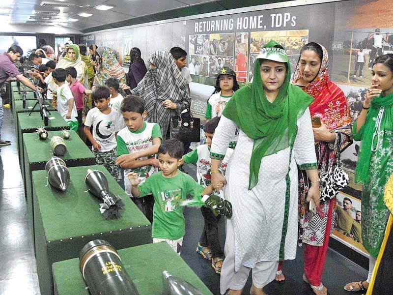 children take an interest in military hardware on display on the azadi train photo app