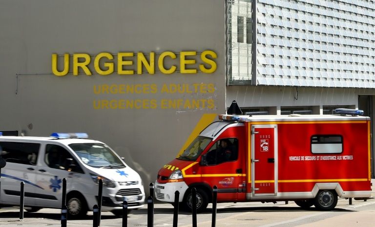 an ambulance and a firefighting vehicle are pictured in front of the nantes chu hospital in this file photo from march 2017 photo afp