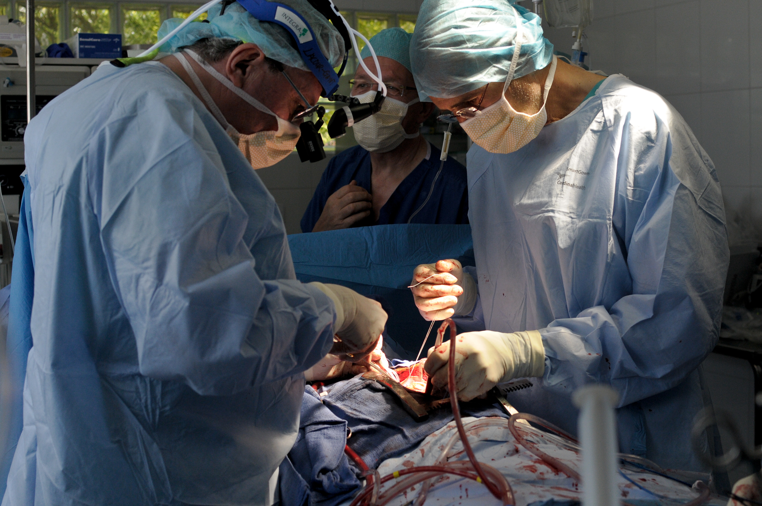 surgeons perform surgery to close the hole between the heart chambers of a patient photo reuters