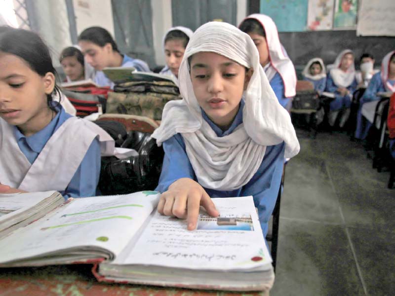 girls attend a class in a govt school photo file