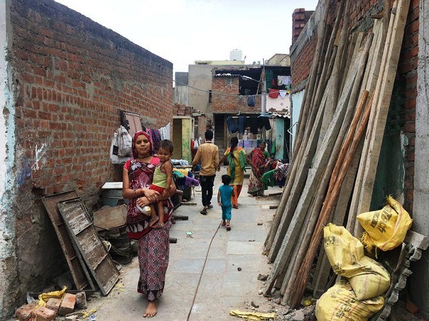 homes in jadibanagar slum where a woman community leader trained by a local non profit has overseen the upgrade of the settlement with water taps toilets and paved lanes and with a guarantee of no evictions for 10 years in ahmedabad india photo reuters