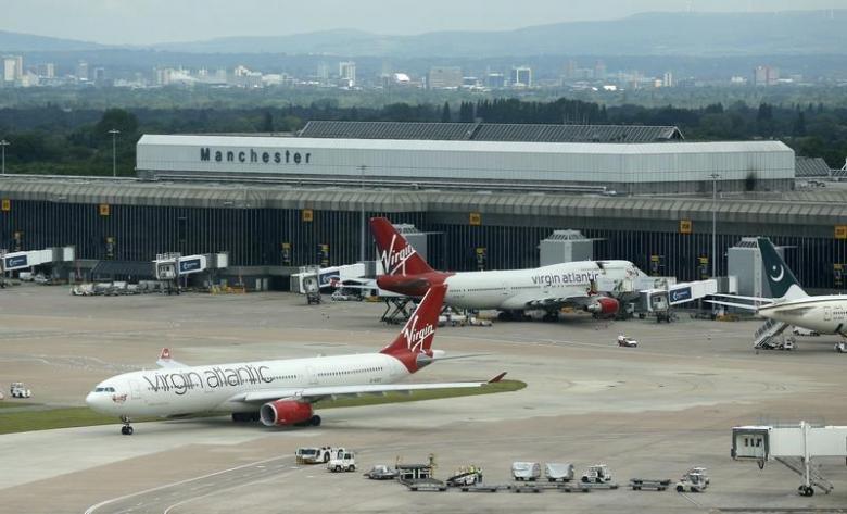 an aircraft taxis across the tarmac at manchester airport northern england photo reuters