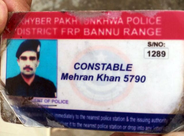 a man shows the identity card of constable mehran khan who was shot dead by unidentified assailants in khyber pakhtunkhwa 039 s bannu district on wednesday august 16 2017 photo express