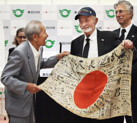 us world war two veteran marvin strombo c meets with tatsuya yasue l brother of sadao yasue to hand over a japanese flag strombo found in a battlefield in 1944 in higashi shirakawa village japan in this photo taken by kyodo august 15 2017 photo reuters us world war two veteran marvin strombo c meets with tatsuya yasue l brother of sadao yasue to hand over a japanese flag strombo found in a battlefield in 1944 in higashi shirakawa village japan in this photo taken by kyodo august 15 2017 photo reuters