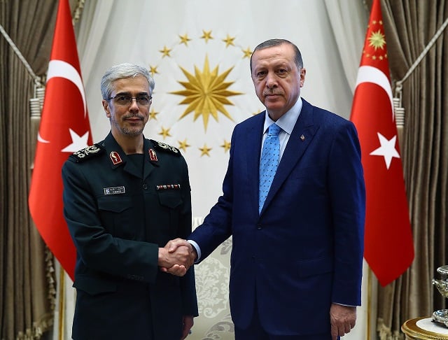 a handout picture released by turkish president 039 s press office on august 16 2017 shows president of turkey recep tayyip erdogan r shakings hands with general staff of iranian armed forces mohammad bagheri before a meeting at the presidential complex in ankara photo afp