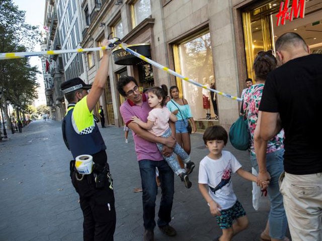 a police officer helps evacuate people photo reuters