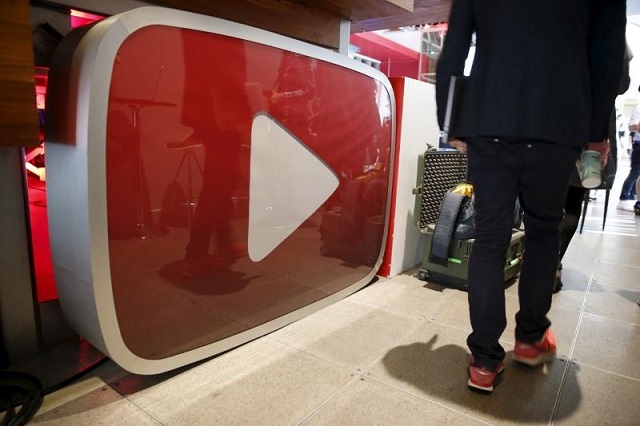 a man walks past a youtube logo at the youtube space la in playa del rey los angeles california united states october 21 2015 photo reuters