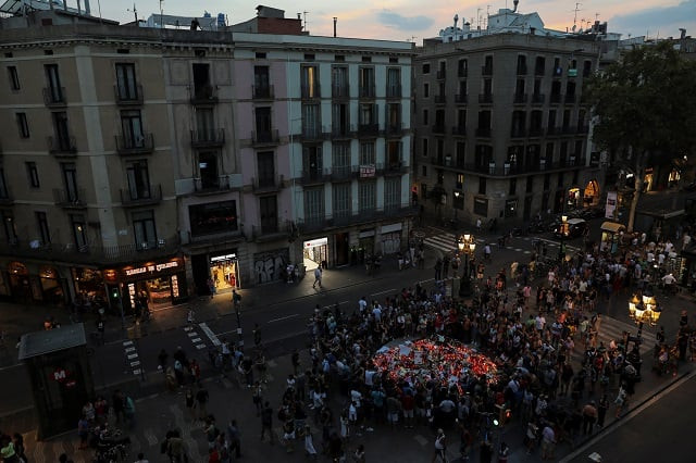people gather around an impromptu memorial a day after a van crashed into pedestrians at las ramblas in barcelona spain august 18 2017 photo reuters people gather around an impromptu memorial a day after a van crashed into pedestrians at las ramblas in barcelona spain august 18 2017 photo reuters