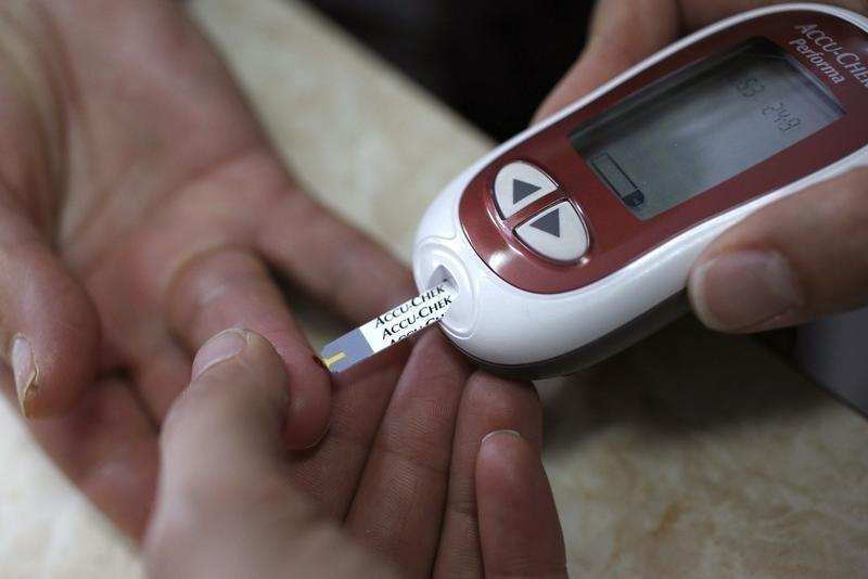 a patient takes a blood glucose test photo reuters