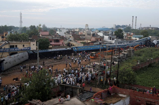 rescue workers and onlookers stand next to derailed coaches of a passenger train at the site of an accident in khatauli in the northern state of uttar pradesh india august 20 2017 photo reuters rescue workers and onlookers stand next to derailed coaches of a passenger train at the site of an accident in khatauli in the northern state of uttar pradesh india august 20 2017 photo reuters