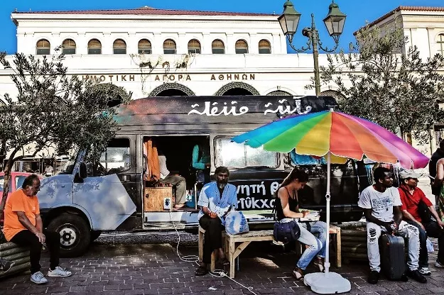 people sit outside a library van in central athens one of the initiatives in greece to offer reading and books to the tens of thousands of refugees stranded in the country photo afp people sit outside a library van in central athens one of the initiatives in greece to offer reading and books to the tens of thousands of refugees stranded in the country photo afp