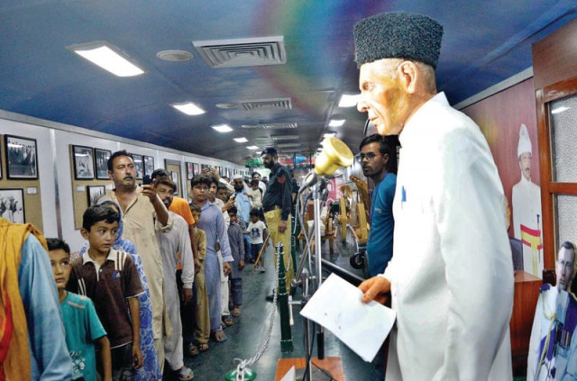 people take keen interest in items displayed in the azadi train photos app people take keen interest in items displayed in the azadi train photos app