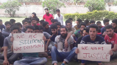 three kashmiri students booked for not standing up during national anthem in india three kashmiri students booked for not standing up during national anthem in india