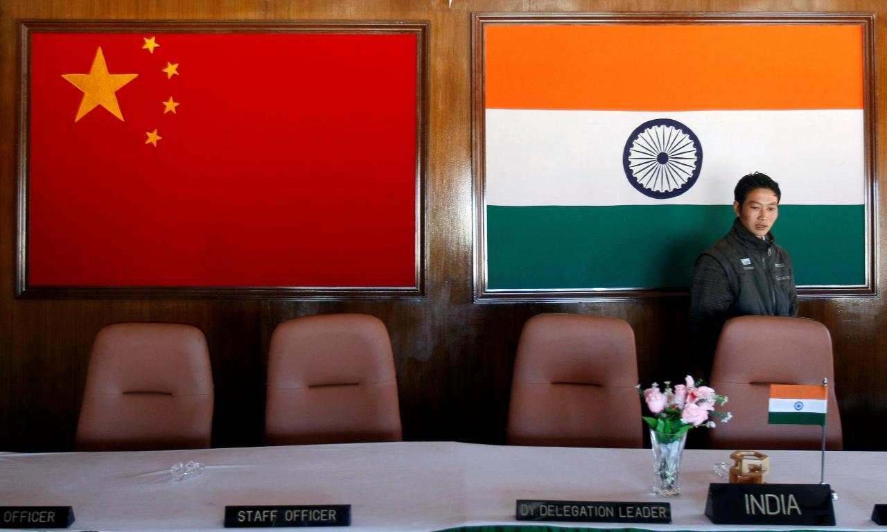 a man walks inside a conference room used for meetings between military commanders of china and india at the indian side of the indo china border at bumla in the northeastern indian state of arunachal pradesh photo reuters