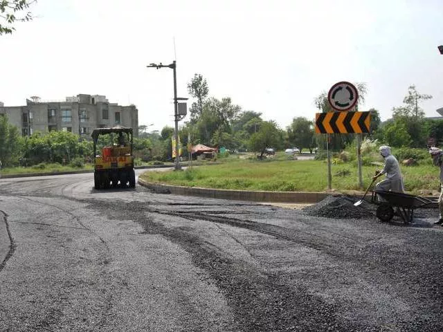 despite reservations the capital authorities on monday initiated developmental work on the widening of ataturk avenue photo file despite reservations the capital authorities on monday initiated developmental work on the widening of ataturk avenue photo file