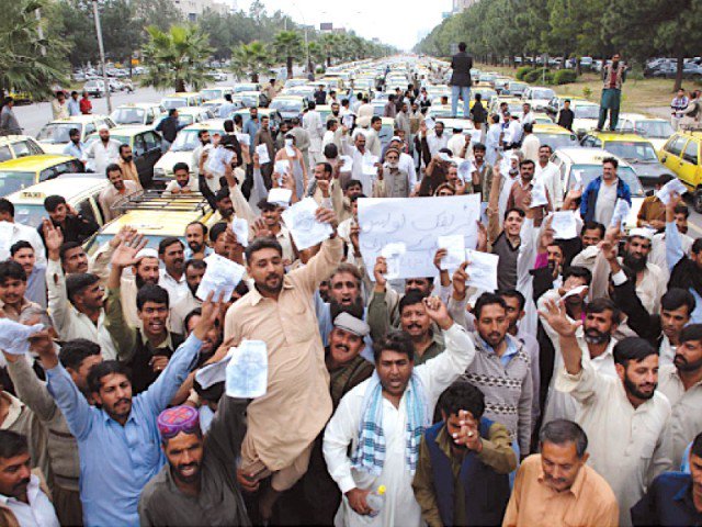 police booked 26 taxi drivers who took to streets to protest against the online ride hailing services on sunday photo express