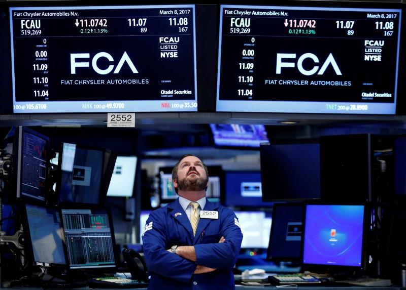 a specialist trader works at the post where fiat chrysler automobiles is traded on the floor of the new york stock exchange nyse in new york us photo reuters