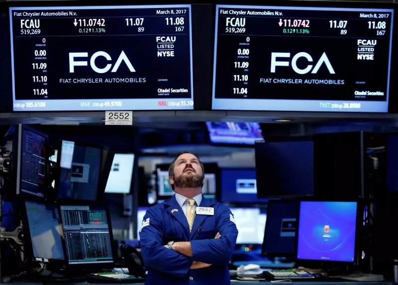 a specialist trader works at the post where fiat chrysler automobiles is traded on the floor of the new york stock exchange nyse in new york us photo reuters a specialist trader works at the post where fiat chrysler automobiles is traded on the floor of the new york stock exchange nyse in new york us photo reuters