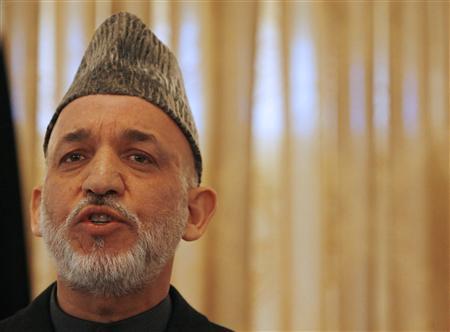 former afghan president says it is against peace and the national interest of the country photo reuters