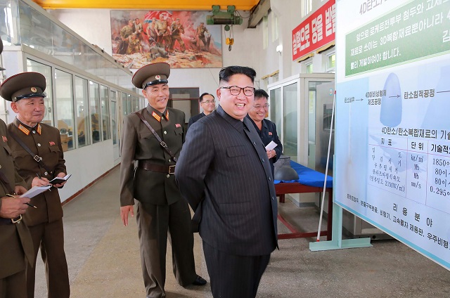 this undated picture released from north korea 039 s official korean central news agency kcna on august 23 2017 shows north korean leader kim jong un 2nd r visiting the chemical material institute of the academy of defense science at an undisclosed location photo afp
