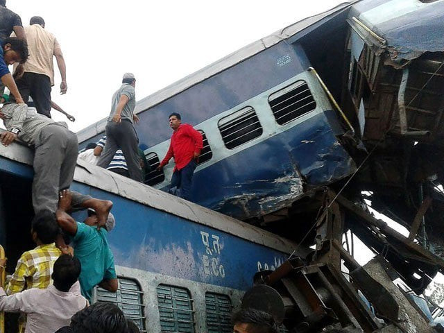 local residents look for survivors on the wreckage of train carriages after an express train derailed near the town of khatauli in the indian state of uttar pradesh on august 19 2017 photo afp local residents look for survivors on the wreckage of train carriages after an express train derailed near the town of khatauli in the indian state of uttar pradesh on august 19 2017 photo afp