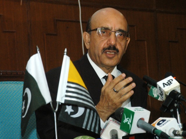 president sardar masood khan was talking to planning commission deputy chairman sartaj aziz photo express