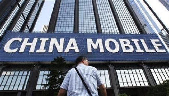 a man stands in front of a china mobile advertisement displayed outside a building in hong kong august 20 2009 photo reuters a man stands in front of a china mobile advertisement displayed outside a building in hong kong august 20 2009 photo reuters
