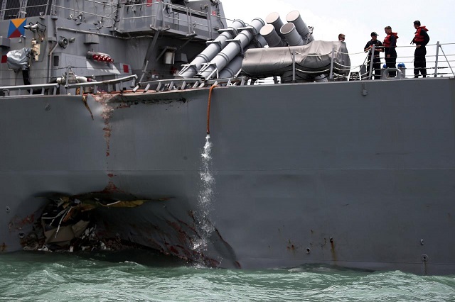 the us navy guided missile destroyer uss john s mccain is seen after a collision in singapore waters august 21 2017 photo reuters ahmad masood