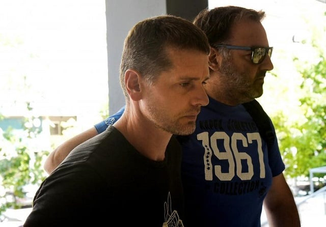 alexander vinnik a 38 year old russian man l suspected of running a money laundering operation is escorted by a plain clothes police officer to a court in thessaloniki greece july 26 2017 photo reuters alexander vinnik a 38 year old russian man l suspected of running a money laundering operation is escorted by a plain clothes police officer to a court in thessaloniki greece july 26 2017 photo reuters