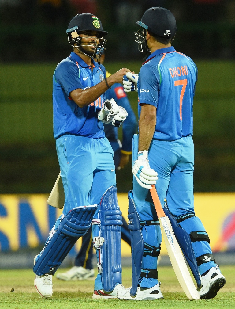 cool as cucumber dhoni 45 put on an unbeaten 100 run stand with kumar 53 to steer india home while chasing revised target of 231 photo afp
