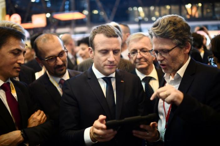 french president emmanuel macron holds a device at the viva technology event dedicated to start ups development innovation and digital technology in paris france photo reuters