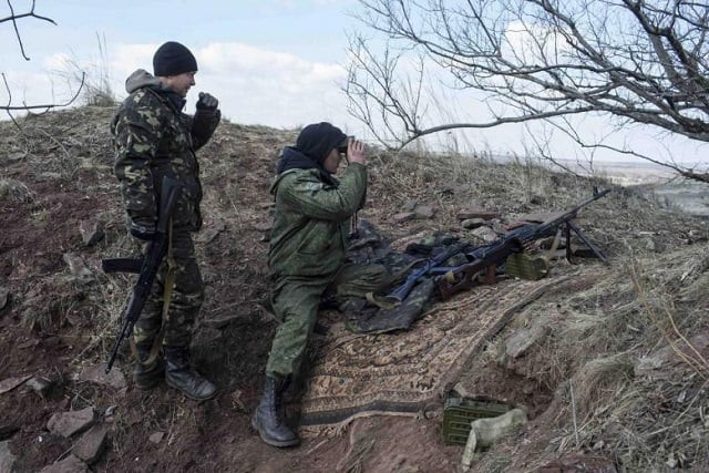 pro russian rebels observe the area at a front line outside the village of molochnoye north east from donetsk march 8 2015 photo reuters pro russian rebels observe the area at a front line outside the village of molochnoye north east from donetsk march 8 2015 photo reuters