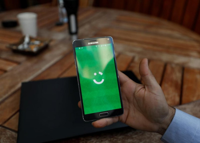 an employee shows the logo of ride hailing company careem on his mobile in his office in the west bank city of ramallah july 17 2017 photo reuters an employee shows the logo of ride hailing company careem on his mobile in his office in the west bank city of ramallah july 17 2017 photo reuters