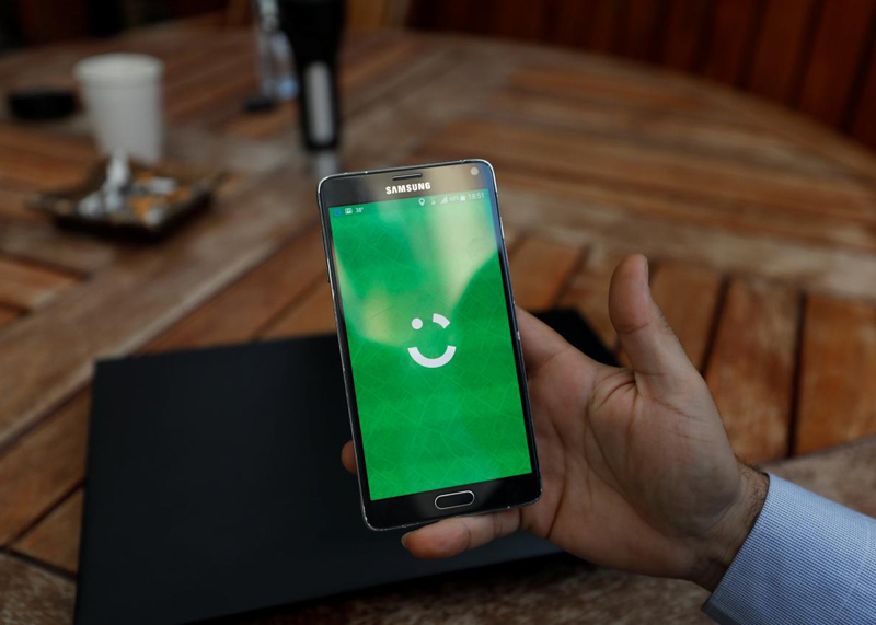 an employee shows the logo of ride hailing company careem on his mobile in his office in the west bank city of ramallah july 17 2017 photo reuters