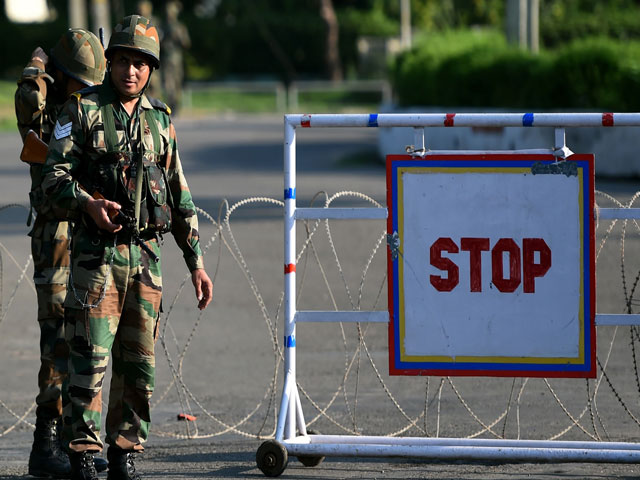 indian soldiers stand guard at a checkpoint at panchkula on august 26 2017 photo afp