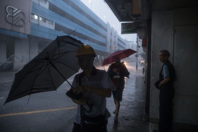 hong kong and macau raised a typhoon 8 signal the third highest warning level early sunday morning as severe tropical storm quot pakhar quot made landfall days after typhoon hato claimed at least 18 lives photo afp